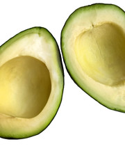 Avocado halves isolated on white background. Parts of fruit pieces in the frame. Close-up