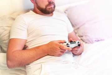 man with a beard playing a game console, copy space