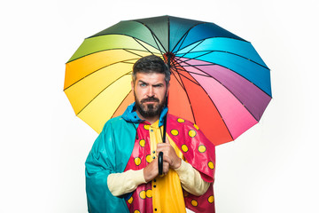 Rain and umbrella november concept. Isolated object on white background. Handsome man with colorfull umbrella.