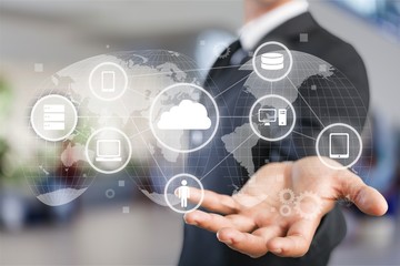 Man touching business elements icons on screen