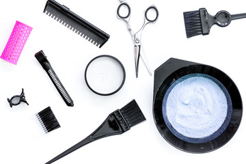 Fototapeta na wymiar Tools for hair dye and hairdye top view white background