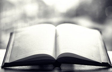open book and a table black and white