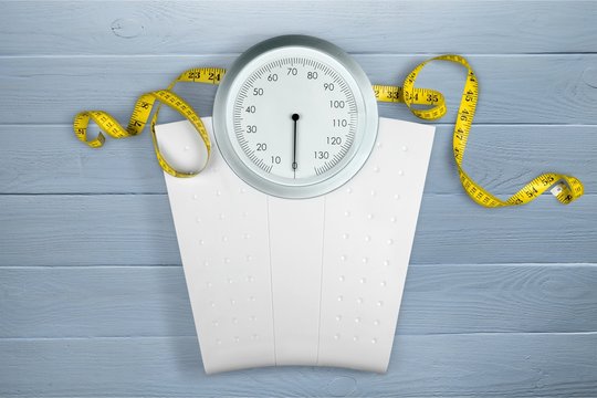 A Measuring Tape on a weight scale