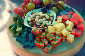 set of cheese on a wooden Board