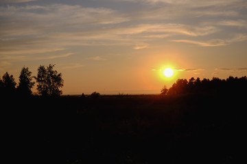 Fototapeta na wymiar Simple and uncomplicated landscape at sunset in orange tones