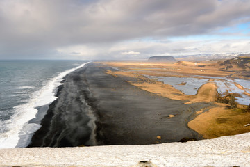 Amazing Icelandic landscape at Vik Cliffs. Beautiful seascape in Iceland. Black sand beach in south...