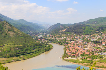 Naklejka premium Aerial view on old town Mtskheta and confluence of the rivers Kura and Aragvi in Georgia