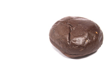 Dark brown donut on an isolated white background