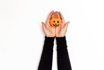 Woman holding a halloween pumpkin on a white background