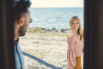 beautiful hippie couple walking near the sea