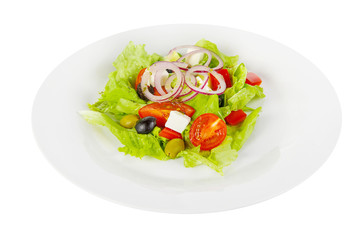 Greek salad with feta, olives, lettuce, red onion, cucumber, cherry tomato, bell pepper, oil on plate, white isolated background Side view. For the menu, restaurant bar cafe
