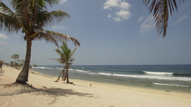 Tropical island with white sandy beach in blue lagoon, palm tree. Patarl white sand beach with turquoise water. Seascape, ocean and beautiful beach. Philippines, Anda, Pangasinan. Travel concept.
