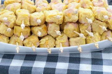 Chinese Steamed Dumpling on fabric pattern background