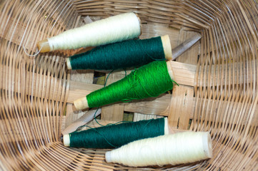 old tool to make the thread bobbin for the shuttle of ancient loom and Cotton is raw for weave, tools to work natural textile fiber