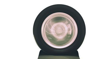 Close up of vehicle wheel rotation on road with blurry motion on white background; tire with clipping path