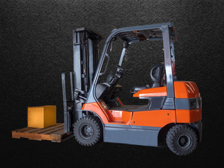 Forklift handling the box of spare parts on pallet in warehouse, isolated on black.