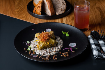 golubtsi Cabbage with rice and meat on a plate of buckwheat and carrots
