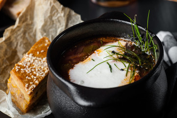 Red borsch. Restaurant serving borsch. food photo on black background