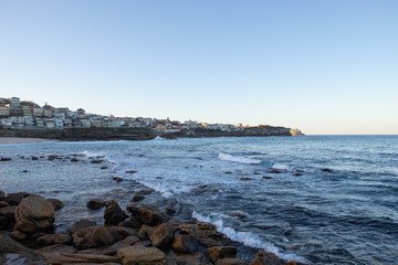 Bronte beach coastline view with clear blue sky.
