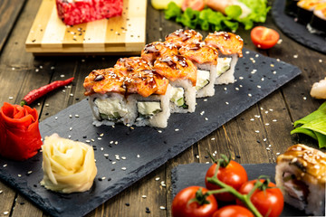 Wonderful sushi set, oriental theme on the old wooden table
