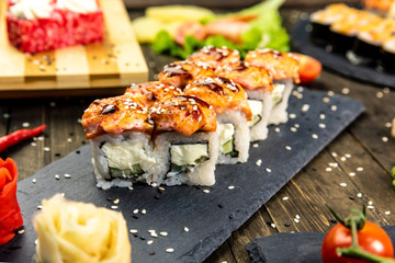 Wonderful sushi set, oriental theme on the old wooden table