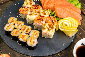 Wonderful sushi set, oriental theme on the old wooden table