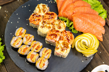 Wonderful sushi set, oriental theme on the old wooden table
