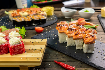 Wonderful sushi set, oriental theme on the old wooden table