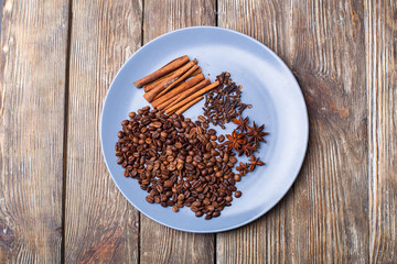 Spicy cinnamon, anise, carnation on a blue plate