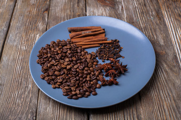 Spicy cinnamon, anise, carnation on a blue plate