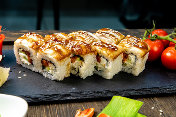 Wonderful sushi set, oriental theme on the old wooden table