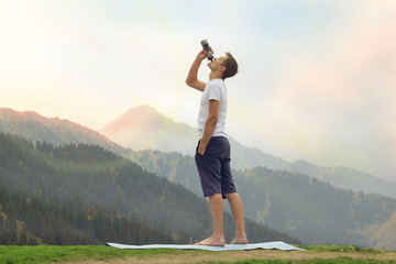 Man drink water after yoga practice