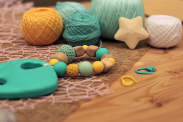 crochet wood and blue and yellow silicon rattle