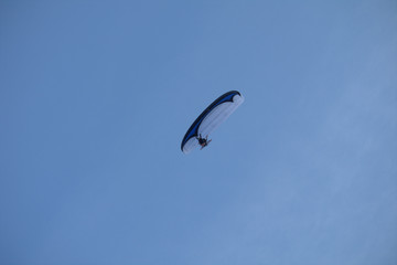 flying in the sky,motorized paraglider,sky,fun,wind,fly,blue,freedom