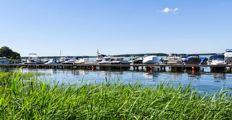 Ships moored at Fleesen Lake jetty in Göhren-Lebbin (Germany)