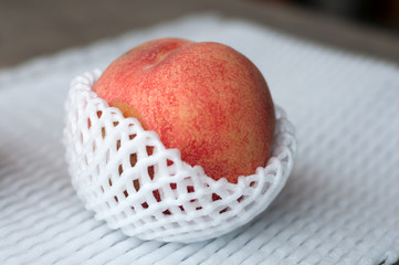 fresh peaches in shockproof