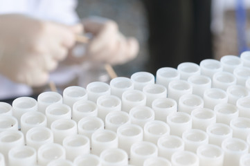 Scientist and Plastics test tube used for chemical and science laboratory