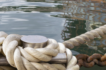 the ship is tied with a mooring rope