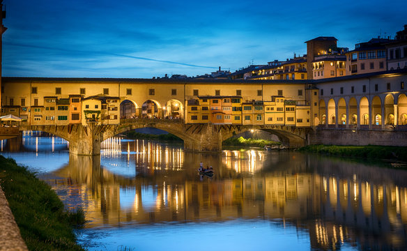 Evening view of the famous bridge Ponte Vecchio on the river Arno in Florence, Italy.