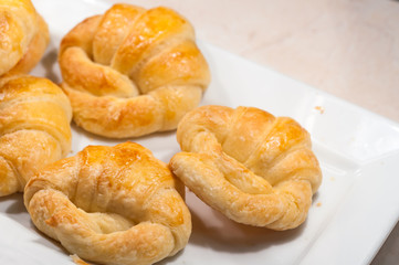 close up of croissants in white dish for breakfast in morning time