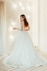 Fototapeta premium beautiful bride in a chic wedding dress