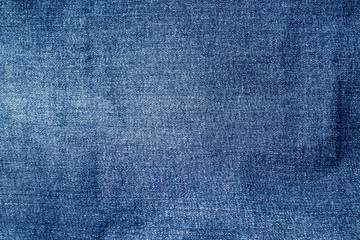 The texture of denim. The background of the blue fabric