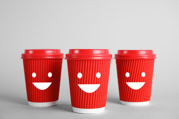 Carton cups on grey background. Mock up for design