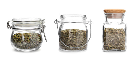 Set of jars with dried parsley on white background