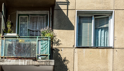 Fototapeta na wymiar Old residential apartment block from communist century yet lived in traditional mode.