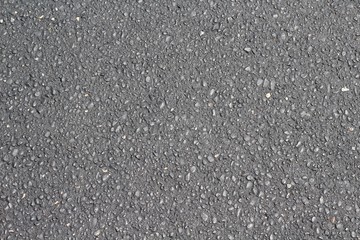 A close view on the blacktop pavement texture surface. 