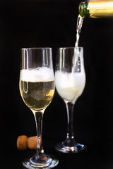 Party concept. Full glass of champagne with party lights background.