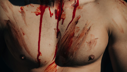halloween muscular chest of man zombie with blood