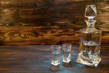 bottle and two glasses of alcohol