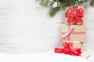 Fototapeta na wymiar Christmas gift boxes and xmas fir tree